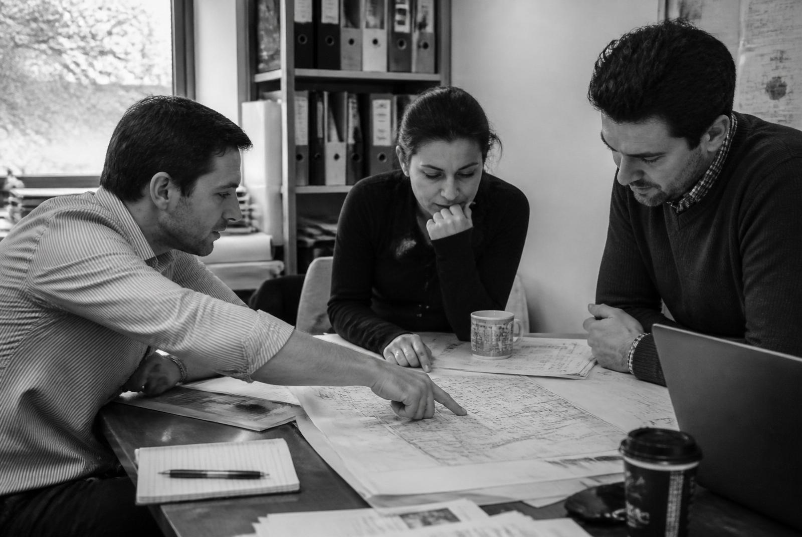 Kent's Marvel team reviewing plans in the office